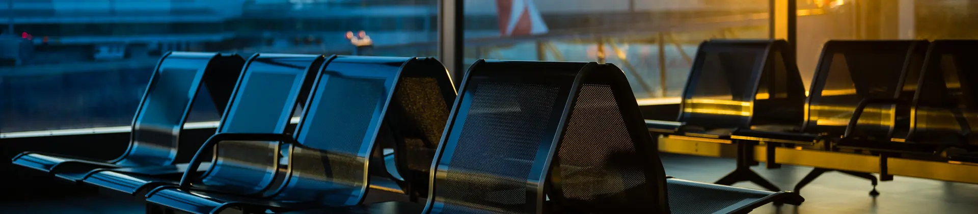 Empty seats at a boarding gate in an airport 