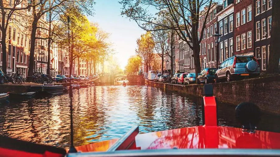 Cruising along Amstel Canal in Amsterdam, Netherlands