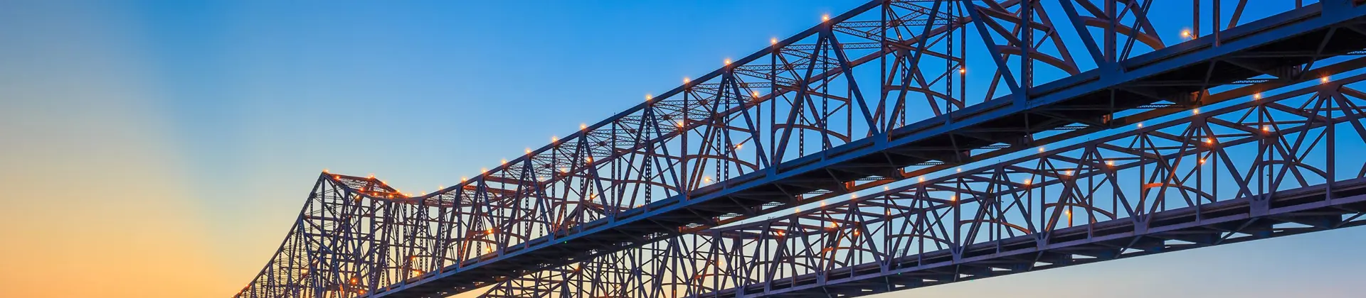 The Crescent City Connection Bridge on the Mississippi river and downtown New Orleans Louisiana