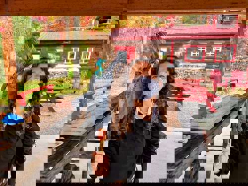 Kathy enjoys some authentic Canadian maple snacks at The Sugar Shack.