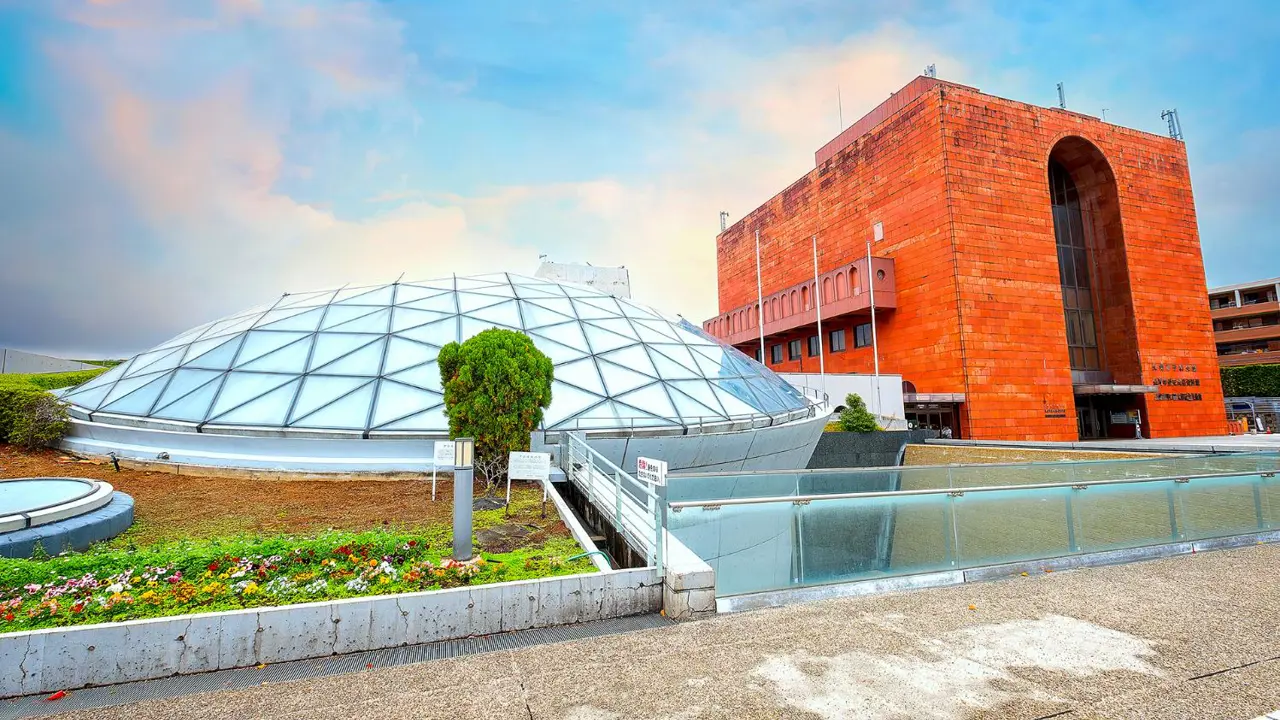 Exterior view of the Nagasaki Atomic Bomb Museum, featuring a modern architectural design and a solemn atmosphere