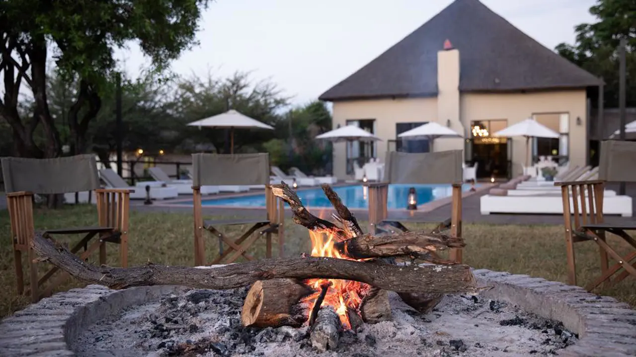 Safari Plains, Limpopo, view of the fire pit and pool in the background