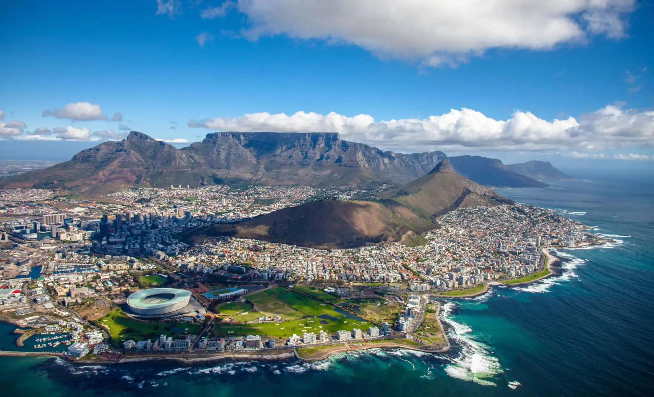 Aerial view of Cape Town with Table Mountain and the coastline in the background