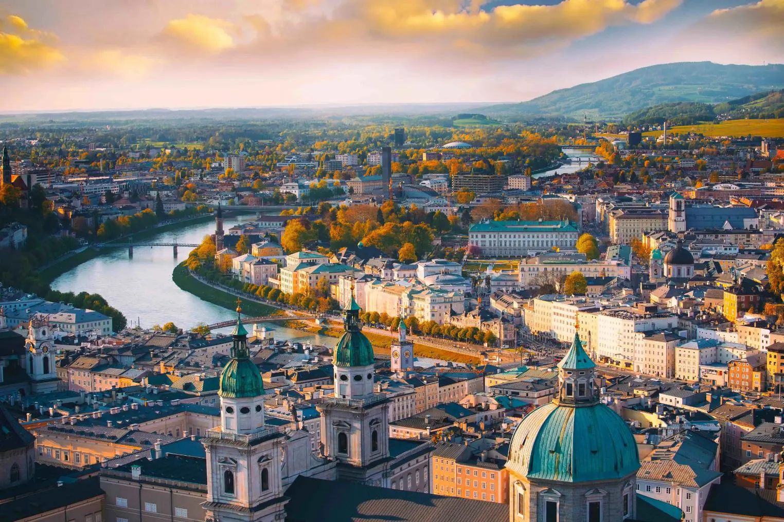 Panoramic view of the historic city of Salzburg and the Salzach river in the evening light