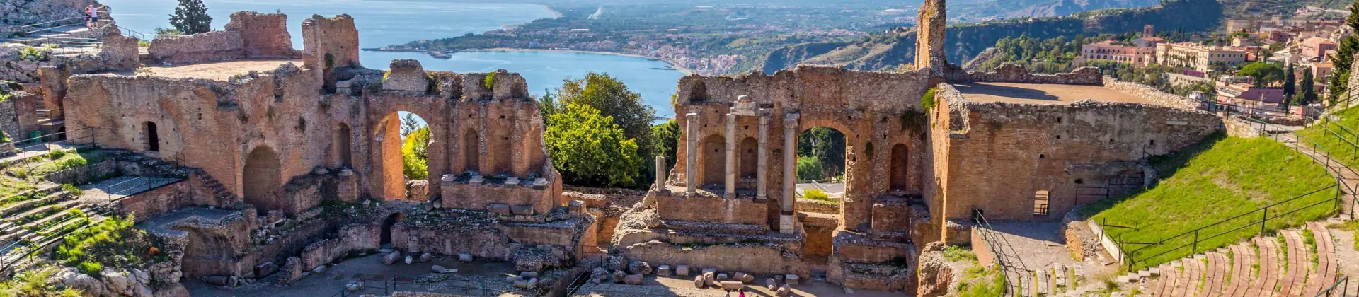 View of Taormina with Theatre of Taormina and Mount Etna, Sicily, Italy 