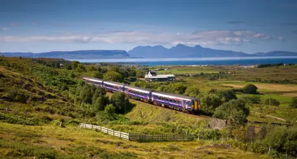 A Sprinter Mallaig Line train going along the railway in the Scottish Highlands