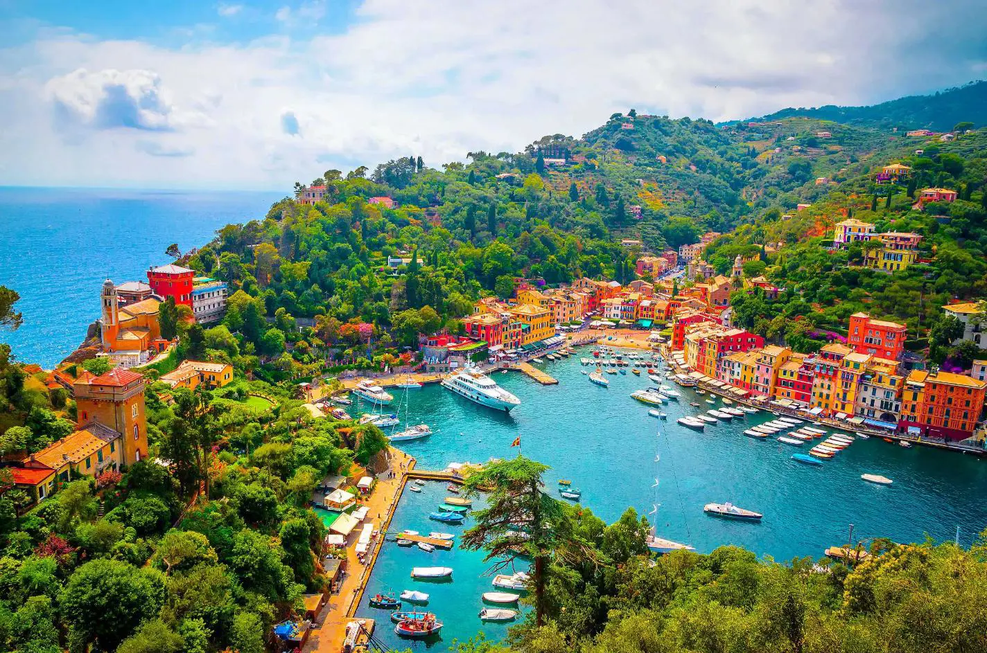 High-angle shot of colourful buildings alongside a marina in Portofino in Italy