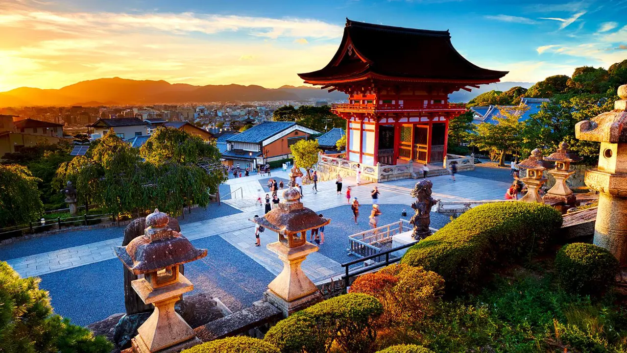 Kiyomizu-dera Temple in Kyoto perched on a hillside, with wooden terraces overlooking colourful autumn foliage