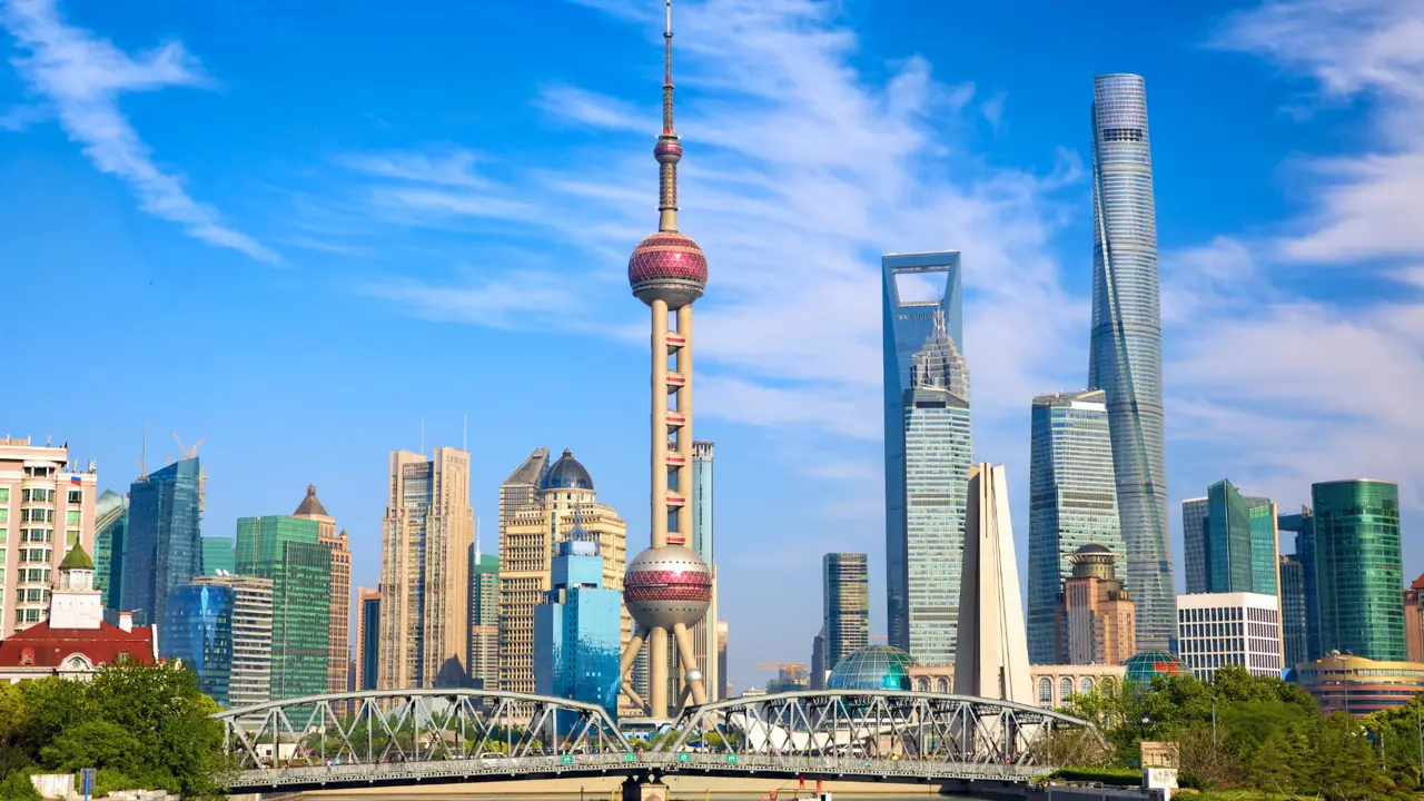 Modern skyscrapers and the Oriental Pearl Tower along the Huangpu River in Shanghai, China