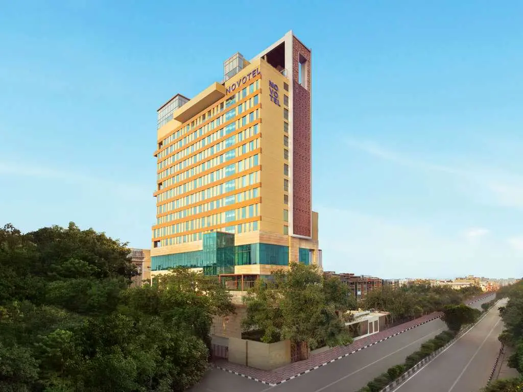 The exterior of Novotel New Delhi City Centre, a tall contemporary building with large windows
