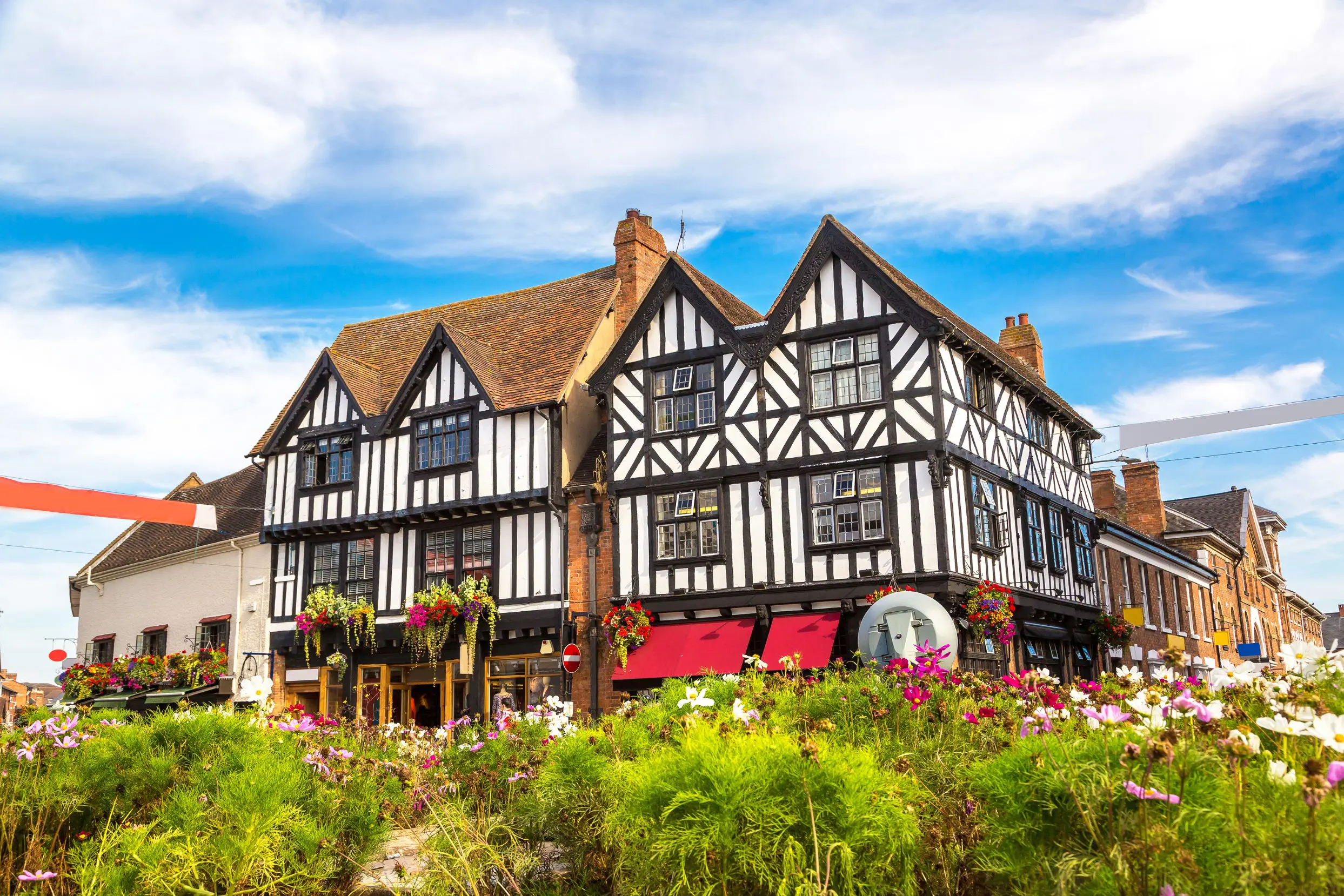 Timber, black & white building on a street corner in Stratford-Upon-Avon