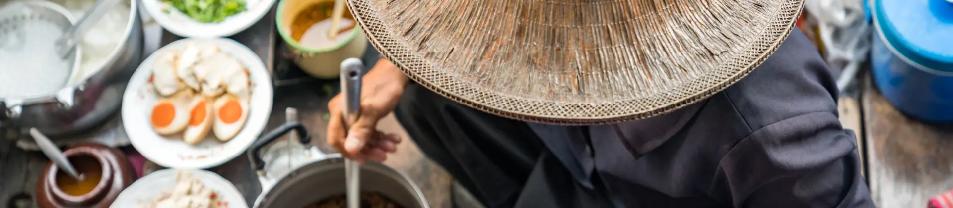 Image of person preparing Thai Food on Floating Market