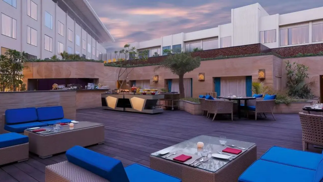The rooftop Sky Bar at the InterContinental Jaipur with outdoor seating and evening lighting
