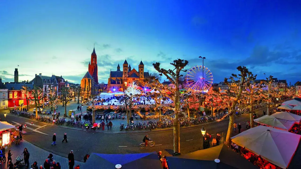 Vrijthof Square in Maastricht decorated for Christmas with festive lights and market stalls